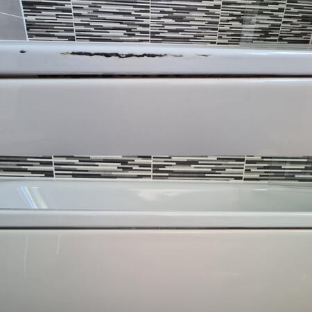 before and after picture of a steel bath with rust damage repaired in Weston-Super-Mare